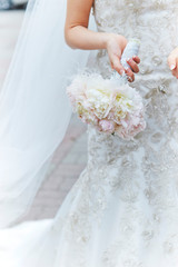 bride with bouquet of flowers