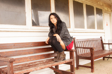 Raven-haired girl in a lack leather jacket