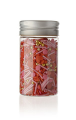 Full color topping sprinkle in glass bottle on isolated