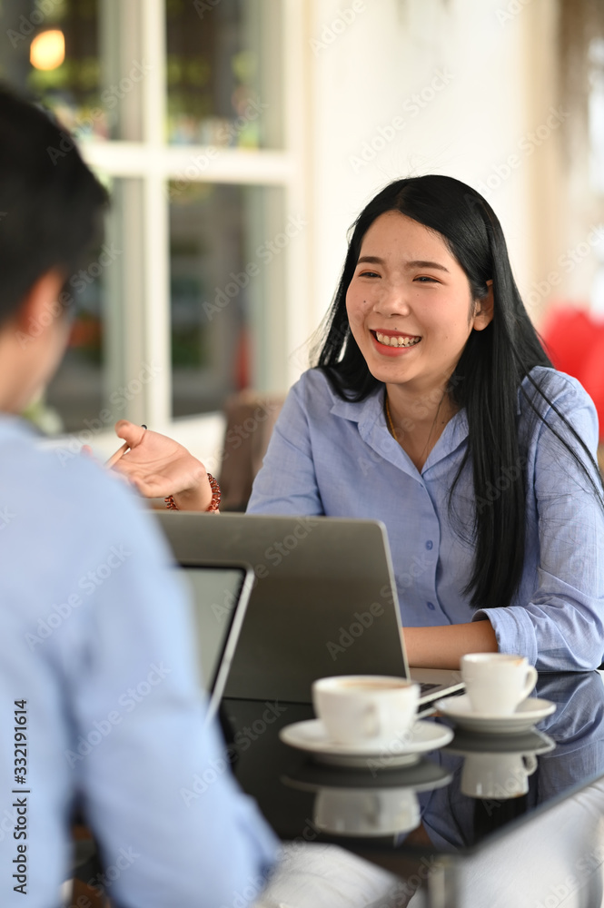 Poster photo of young business developer team talking/discussing/working together with computer tablet and 