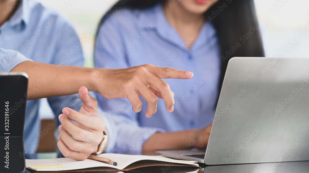Poster cropped image of business developer team working together by using a computer tablet and laptop whil