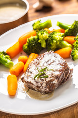 Juicy Beef Rib Eye Steak with mushroom sauce and baby vegetable