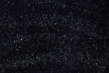 Abstract elegant glitter sparkle bokeh defocused on black background concept night sky, space, stars, galaxy