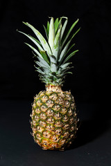 Pineapple on a black background. minimalistic, modern, with copy space