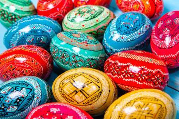 Background with painted Easter Eggs. Easter eggs on wooden background.