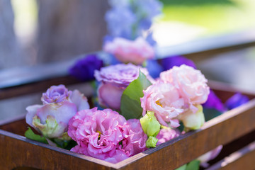 Bouquets of fresh flowers decoration of the festive table. Celebrating an open air party. Decor Details