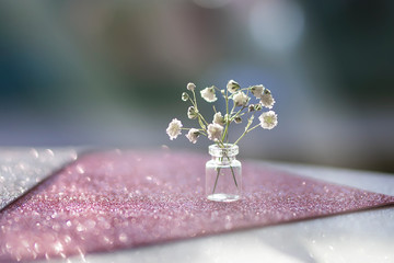 small bottle of flowers close up