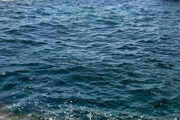 clear Blue sea water background, wallpaper and texture. selective focus