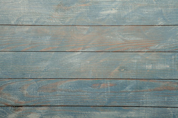 Fototapeta premium Vintage blue wood background texture with knots and nail holes. Old painted wood wall. Blue abstract background. Vintage wooden dark blue horizontal boards. Front view with copy space. Background for