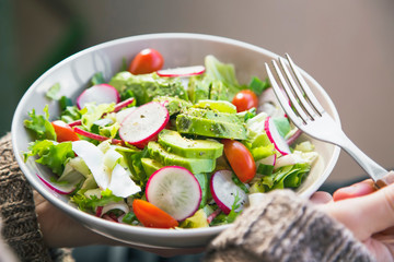 Clean eating, vegan healthy salad bowl , woman holding salad bowl, plant based healthy diet with greens, salad, chickpeas and vegetables