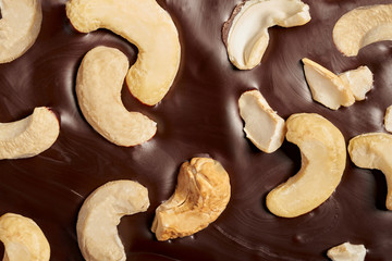 Chocolate bar with cashews close-up