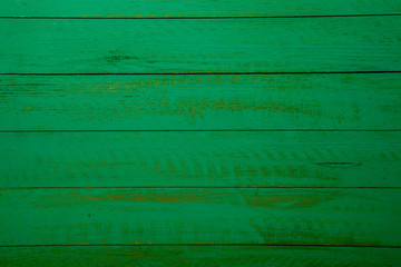 Vintage green wood background texture with knots and nail holes. Old painted wood wall. Brown abstract background. Vintage green wooden dark horizontal boards. Front view with copy space. Background f