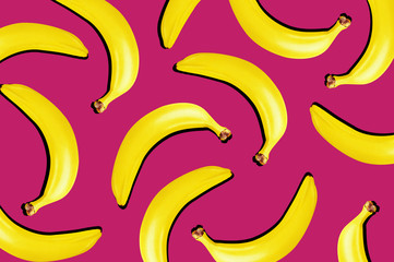 Bright summer background with open composition. Fresh ripe bananas on vivid saturated pink background with hard dark shadows. Top view.