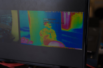 Monitor of thermographic image screening body temperature in the hospital.Camera monitoring...