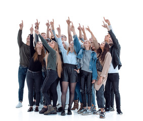 group of happy young people pointing up at a copy of the space