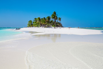 tiny little sandy island with palm tree and white sand beach in the turquoise lagoon of Cocos Keeling atollm landscapephotography