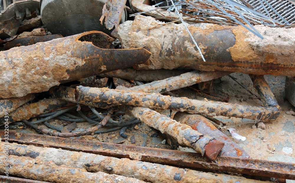 Wall mural old rusty pipes of a construction site in the landfill