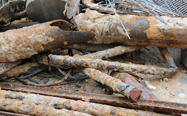 old rusty pipes of a construction site in the landfill