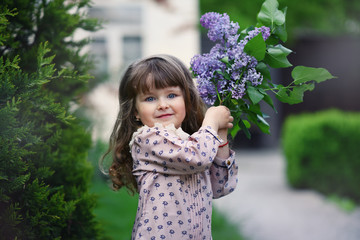 little girl with a bouquet of wild flowers.  mothers Day