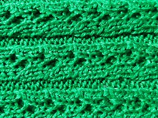 green knitted texture of fabric