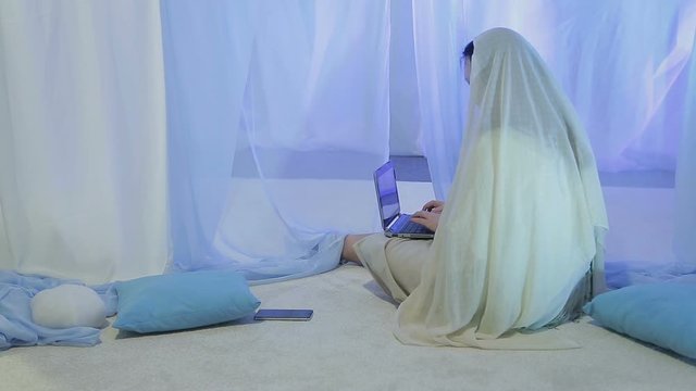 woman bride in white before the wedding communicates in social networks and accepts congratulations