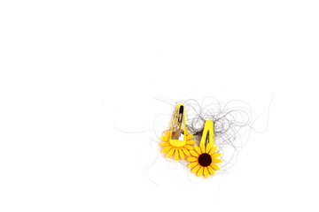 Yellow sunflower hair clip with hair loss, hair loss every day, serious problems and hair loss on a white background.