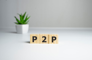 Close-up Of A P2p Word On Wooden Blocks