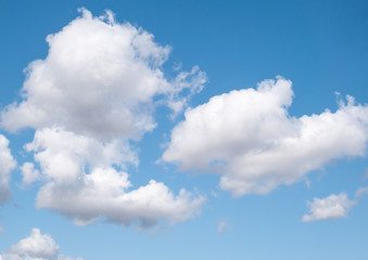 Naklejka na ściany i meble White clouds on blue sky background