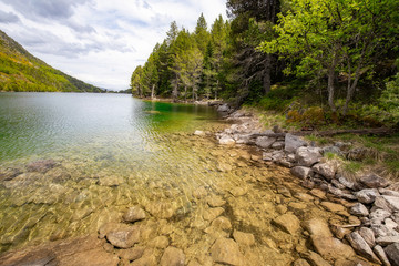 Beautiful Pyrenees mountain landscape, nice lake with transparent water from Spain, Catalonia.