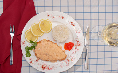 Cooked Rib-eye meal rice, steak and lemon. Glass with wine. Flat tlay