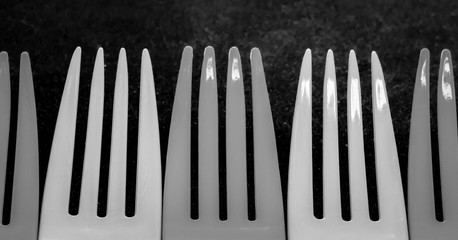 plastic kitchen eating utensils in a row