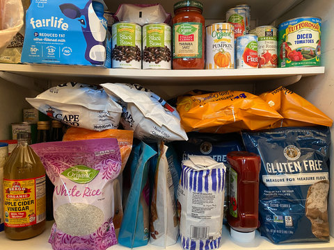 WOODBRIDGE, NEW JERSEY / USA - March 13, 2020: Dried and shelf stable food items are stored in a residential pantry, in preparation for potential Coronavirus quarantine in this illustrative editorial 