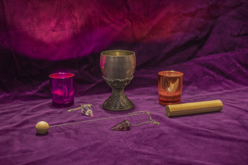 Fortune telling with crystal dowsing pendulums and a divining rod