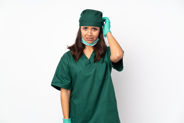 Surgeon woman in green uniform isolated on white background having doubts