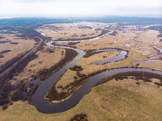 Nature in spring. Forests, fields, lake, river. View from the sky. The photo was taken by a copter. Panorama. The concept is a favorable environment. Blue sky. Background.