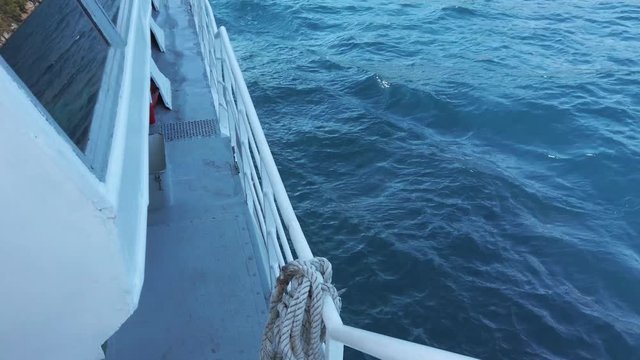 Water wetting the deck of a catamaran