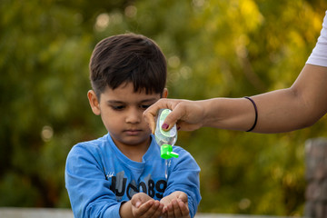 Indian child coughing on his elbow showing tips to protecting corona virus