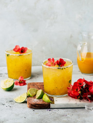 Fresh mango mojiton cocktail with flowers