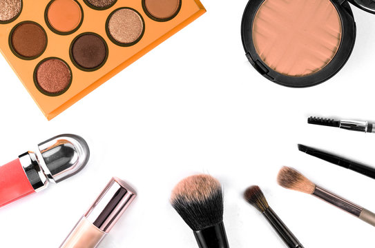 Makeup brush and cosmetics, on a white background