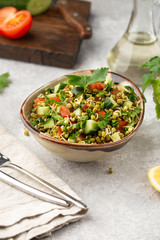 Healthy salad with mung beans, tomatoes, cucumber, lettuce and greens