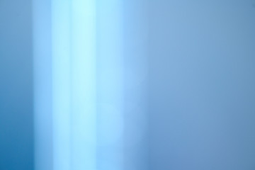 Abstract Lens Flare backdrop, Technology background, prism Bokeh Lights. Photo of Leaking Reflection of a Glass, Crystal, Defocused Shining Colorful Light Leaks, Rays blue Background. 