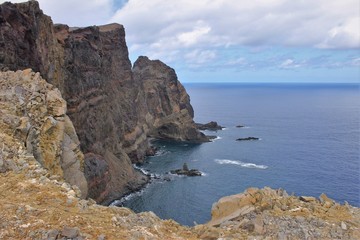 Madeira is a Portuguese island. The island is the top of a massive submerged shield volcano that rises about 6 km from the floor of the Atlantic Ocean. Madeira is the largest island of the group.