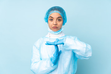 Young surgeon Indian woman in blue uniform making time out gesture
