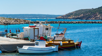 Fototapeta na wymiar fishers boats laying in the harbor in Greece Kos