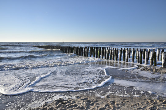Breakwaters on the beach in Vlissingen Holland