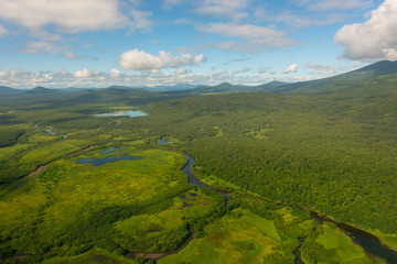 Obraz premium aerial view of Kamchatka volcanos, green valleys, snow and ice and the wonderful view of pure nature.