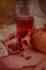 Pomegranate and pomegranate juice. Pomegranate still life