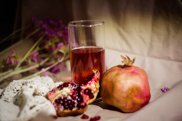 Pomegranate and pomegranate juice. Pomegranate still life