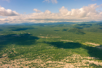aerial view of Kamchatka volcanos, green valleys, snow and ice and the wonderful view of pure nature.