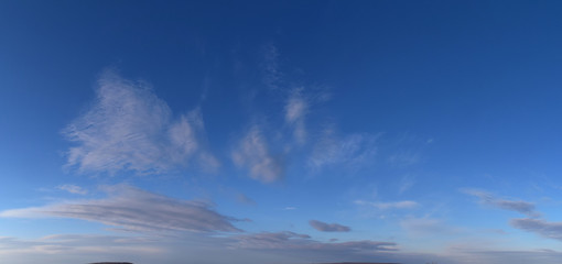 Fototapeta premium Spring. Daytime Panoramic photo of the cloudy sky, March, fresh air.